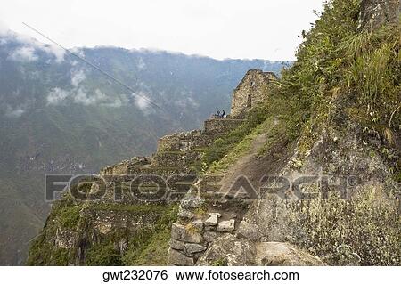 High angle view of the old ruins, Aguas Calientes, Mt Huayna Picchu, Machu Picchu, Cusco Region, Peru View Large Photo Image Stock Photograph - High angle view of the old ruins, Aguas Calientes, Mt Huayna Picchu, Machu Picchu, Cusco Region, Peru. Fotosearch