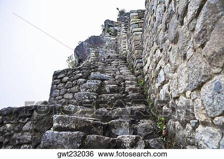 Low angle view of ruined steps, Aguas Calientes, Mt Huayna Picchu, Machu Picchu, Cusco Region, Peru View Large Photo Image Stock Photograph - Low angle view of ruined steps, Aguas Calientes, Mt Huayna Picchu, Machu Picchu, Cusco Region, Peru. Fotosearch