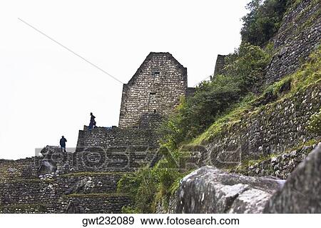 Low angle view of ruins, Aguas Calientes, Mt Huayna Picchu, Machu Picchu, Cusco Region, Peru View Large Photo Image Stock Photo - Low angle view of ruins, Aguas Calientes, Mt Huayna Picchu, Machu Picchu, Cusco Region, Peru. Fotosearch