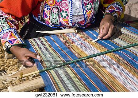 Mid section view of a woman weaving in a loom, Aguanacancha, Peru View Large Photo Image Stock Image - Mid section view of a woman weaving in a loom, Aguanacancha, Peru. Fotosearch