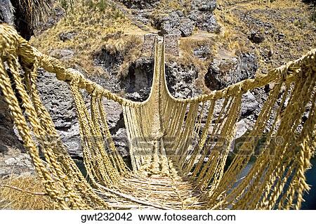Rope bridge across a mountain, Queswachaca, Peru View Large Photo Image Stock Image - Rope bridge across a mountain, Queswachaca, Peru. Fotosearch
