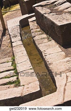 Water flowing through a stone's drain, Pisaq, Urubamba Valley, Peru View Large Photo Image Stock Photo - Water flowing through a stone's drain, Pisaq, Urubamba Valley, Peru. Fotosearch
