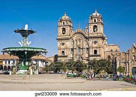 Stock Photo - Fountain in front of a church, La Compania, Plaza-De-Armas, Cuzco, Peru. Fotosearch