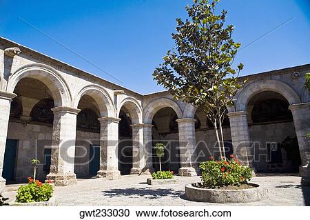 Low angle view of a tree in the courtyard of a building, Santa Catalina Convent, Arequipa, Peru View Large Photo Image Stock Image - Low angle view of a tree in the courtyard of a building, Santa Catalina Convent, Arequipa, Peru. Fotosearch