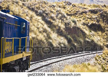 Train passing through a landscape, Puno, Cuzco, Peru View Large Photo Image Picture - Train passing through a landscape, Puno, Cuzco, Peru. Fotosearch