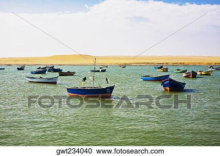 Stock Image - Boats anchored in the sea, Paracas National Reserve, Paracas, Ica Region, Peru. Fotosearch