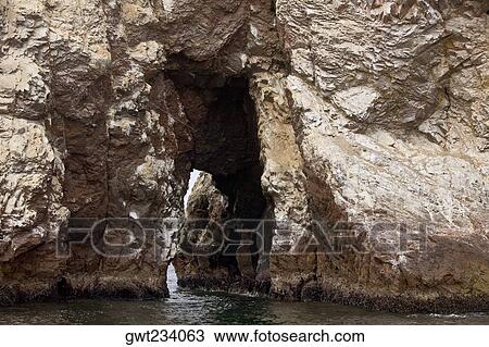 Cave in a cliff, Ballestas Islands, Paracas National Reserve, Paracas, Ica Region, Peru View Large Photo Image Stock Image - Cave in a cliff, Ballestas Islands, Paracas National Reserve, Paracas, Ica Region, Peru. Fotosearch