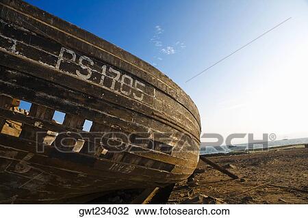Stock Image - Close-up of an abandoned boat on the beach, Town Of El Chaco, Peru. Fotosearch