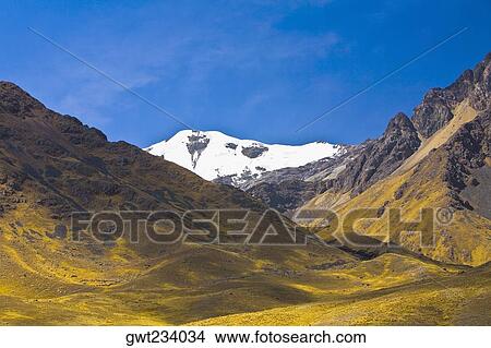 Picture - Low angle view of a snowcovered mountain, Puno, Peru. Fotosearch