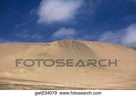 Sand dunes in a desert, Paracas National Reserve, Paracas, Ica Region, Peru View Large Photo Image Stock Photo - Sand dunes in a desert, Paracas National Reserve, Paracas, Ica Region, Peru. Fotosearch