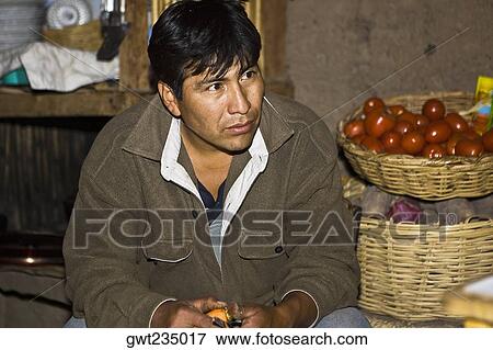Close-up of a mature man sitting at a market stall, San Juan de Chuccho, Peru View Large Photo Image Stock Photo - Close-up of a mature man sitting at a market stall, San Juan de Chuccho, Peru. Fotosearch