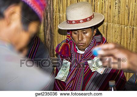 Close-up of a young man sitting at a wedding ceremony, Taquile Island, Lake Titicaca, Puno, Peru View Large Photo Image Stock Photograph - Close-up of a young man sitting at a wedding ceremony, Taquile Island, Lake Titicaca, Puno, Peru. Fotosearch