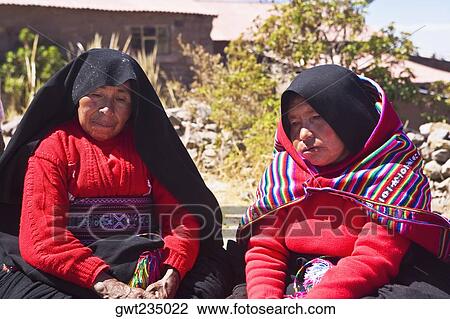 Close-up of two mature women taking part in a wedding ceremony, Taquile Island, Lake Titicaca, Puno, Peru View Large Photo Image Stock Image - Close-up of two mature women taking part in a wedding ceremony, Taquile Island, Lake Titicaca, Puno, Peru. Fotosearch