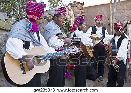 Stock Image - Five guitarists performing, Lake Titicaca, Taquile Island, Puno, Peru. Fotosearch