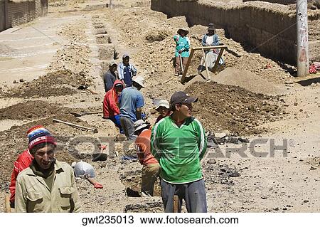High angle view of a group of people digging a road, Puno, Cuzco, Peru View Large Photo Image Stock Image - High angle view of a group of people digging a road, Puno, Cuzco, Peru. Fotosearch