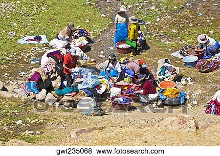 High angle view of a group of women washing clothes, Puno, Cuzco, Peru View Large Photo Image Stock Photo - High angle view of a group of women washing clothes, Puno, Cuzco, Peru. Fotosearch