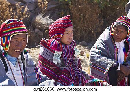 Mature man and a young man sitting with a groom, Taquile Island, Lake Titicaca, Puno, Peru View Large Photo Image Stock Image - Mature man and a young man sitting with a groom, Taquile Island, Lake Titicaca, Puno, Peru. Fotosearch