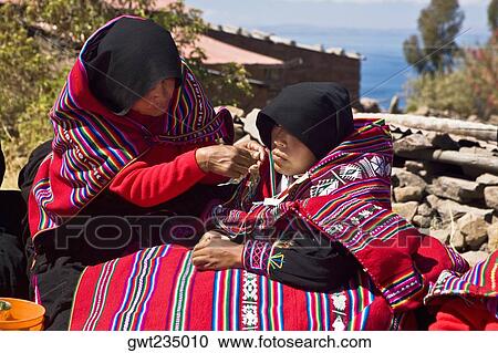 Mid adult woman grooming a bride for wedding, Taquile Island, Lake Titicaca, Puno, Peru View Large Photo Image Stock Image - Mid adult woman grooming a bride for wedding, Taquile Island, Lake Titicaca, Puno, Peru. Fotosearch