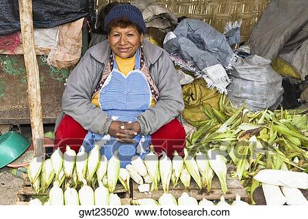 Portrait of a mature woman sitting at a market stall, Ica, Ica Region, Peru View Large Photo Image Stock Image - Portrait of a mature woman sitting at a market stall, Ica, Ica Region, Peru. Fotosearch