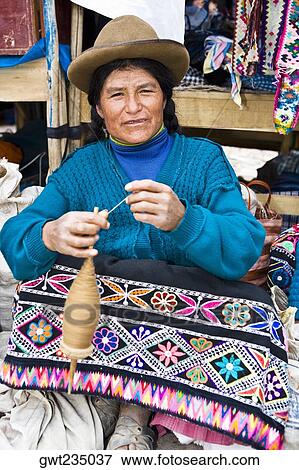 Portrait of a mature woman spinning a spool, Peru View Large Photo Image Stock Photo - Portrait of a mature woman spinning a spool, Peru. Fotosearch