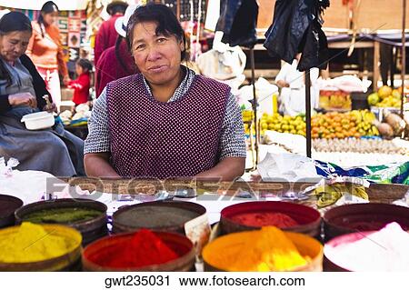 Portrait of a mature woman standing at a market stall, Peru View Large Photo Image Stock Image - Portrait of a mature woman standing at a market stall, Peru. Fotosearch