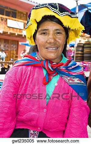 Portrait of a mid adult woman sitting and smiling, Peru View Large Photo Image Stock Photography - Portrait of a mid adult woman sitting and smiling, Peru. Fotosearch