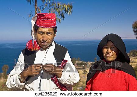 Portrait of a newlywed young couple standing, Taquile Island, Lake Titicaca, Puno, Peru View Large Photo Image Stock Photo - Portrait of a newlywed young couple standing, Taquile Island, Lake Titicaca, Puno, Peru. Fotosearch