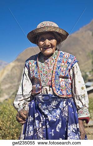 Portrait of a senior woman holding a cane and standing, Coshnirua, Peru View Large Photo Image Stock Photography - Portrait of a senior woman holding a cane and standing, Coshnirua, Peru. Fotosearch