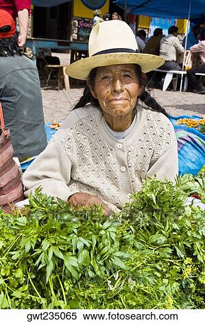 Portrait of a senior woman sitting at a market stall View Large Photo Image Stock Photography - Portrait of a senior woman sitting at a market stall. Fotosearch