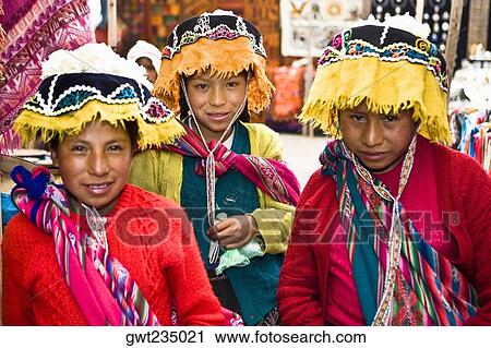 Portrait of three girls in a market, Pisaq, Urubamba Valley, Peru View Large Photo Image Stock Image - Portrait of three girls in a market, Pisaq, Urubamba Valley, Peru. Fotosearch