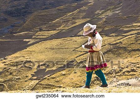 Side profile of a girl walking on a hill, Peru View Large Photo Image Picture - Side profile of a girl walking on a hill, Peru. Fotosearch