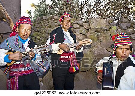 Stock Image - Three guitarists performing, Lake Titicaca, Taquile Island, Puno, Peru. Fotosearch
