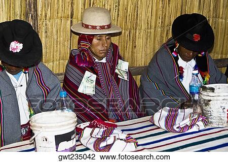 Two mature men sitting with a groom at a table, Taquile Island, Lake Titicaca, Puno, Peru View Large Photo Image Stock Image - Two mature men sitting with a groom at a table, Taquile Island, Lake Titicaca, Puno, Peru. Fotosearch