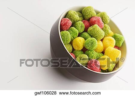 Stock Photo - Close-up of a bowl of color cereals. Fotosearch