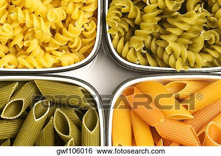 Close-up of raw pasta in bowls View Large Photo Image Stock Photograph - Close-up of raw pasta in bowls. Fotosearch