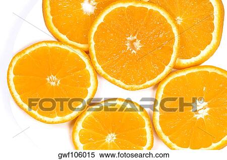 Close-up of slices of oranges in a plate View Large Photo Image Stock Photography - Close-up of slices of oranges in a plate. Fotosearch