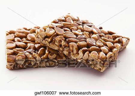 Close-up of two peanut brittles View Large Photo Image Stock Photo - Close-up of two peanut brittles. Fotosearch
