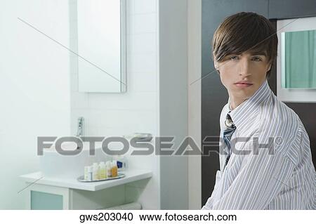 Stock Image - Portrait of a businessman thinking. Fotosearch