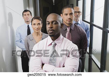 Business executives standing in a corridor View Large Photo Image Stock Photography - Business executives standing in a corridor. Fotosearch