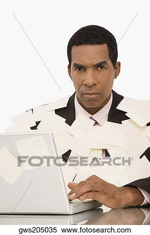 Businessman working on a laptop and covering with adhesive notes View Large Photo Image Stock Photography - Businessman working on a laptop and covering with adhesive notes. Fotosearch