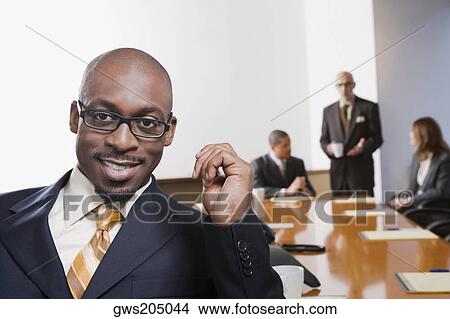 Portrait of a businessman smiling View Large Photo Image Picture - Portrait of a businessman smiling. Fotosearch