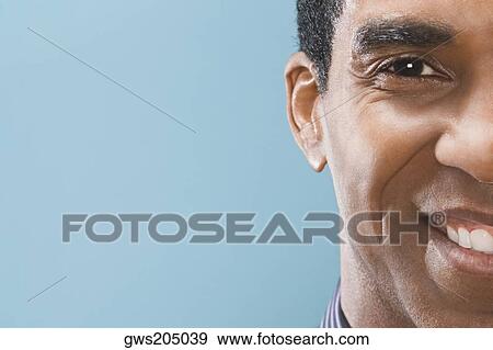 Portrait of a businessman smiling View Large Photo Image Stock Photo - Portrait of a businessman smiling. Fotosearch