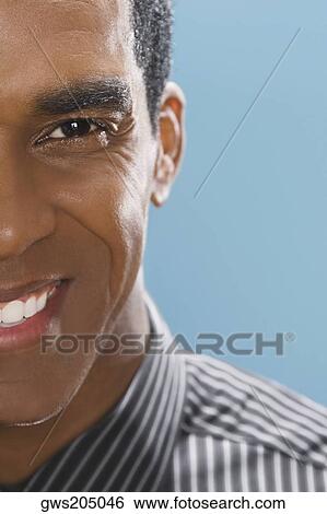 Portrait of a businessman smiling View Large Photo Image Stock Photograph - Portrait of a businessman smiling. Fotosearch