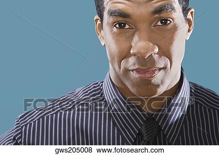 Portrait of a businessman staring View Large Photo Image Stock Photo - Portrait of a businessman staring. Fotosearch