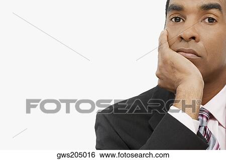 Portrait of a businessman thinking View Large Photo Image Stock Photograph - Portrait of a businessman thinking. Fotosearch