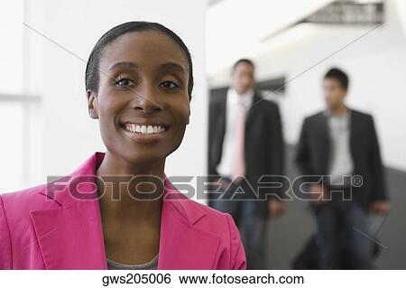 Stock Photograph - Portrait of a businesswoman smiling. Fotosearch