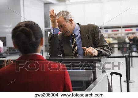 Picture - Businessman looking angry. Fotosearch