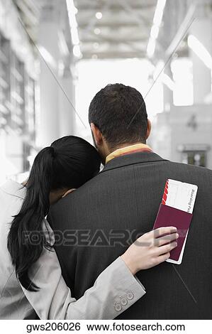 Rear view of a businesswoman with her head on a businessman's shoulder View Large Photo Image Stock Photograph - Rear view of a businesswoman with her head on a businessman's shoulder. Fotosearch