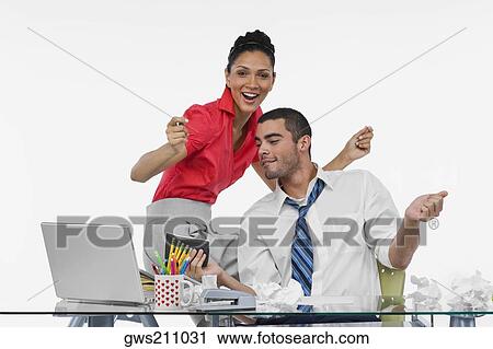 Businesswoman and a businessman dancing together in an office View Large Photo Image Stock Image - Businesswoman and a businessman dancing together in an office. Fotosearch
