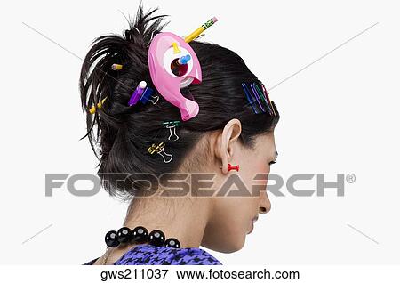 Close-up of various office supply items in a young woman's hair View Large Photo Image Stock Photo - Close-up of various office supply items in a young woman's hair. Fotosearch